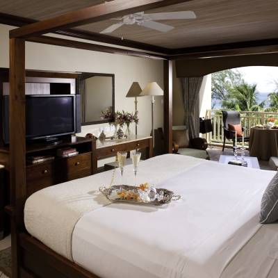 a bedroom with a large bed in a hotel room