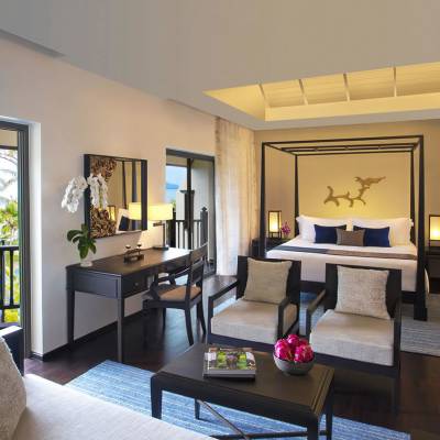 a living room filled with furniture and a large window