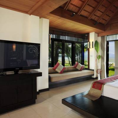 a room filled with furniture and a flat screen tv
