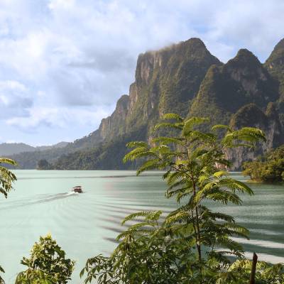 a body of water with a mountain in the background