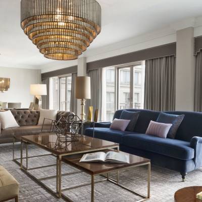 a living room filled with furniture and a large window