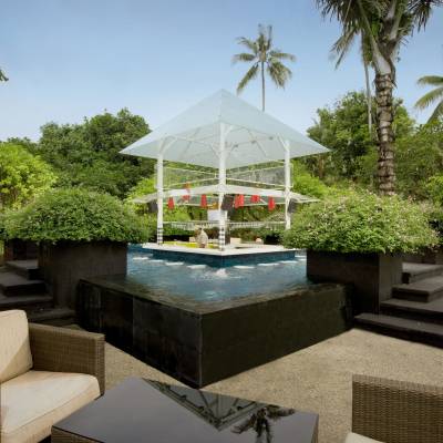 a table that has a umbrella in a garden