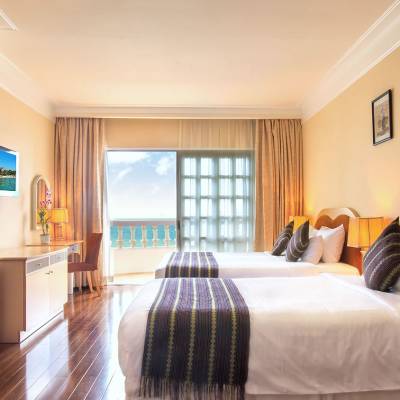 a bedroom with a bed in a room