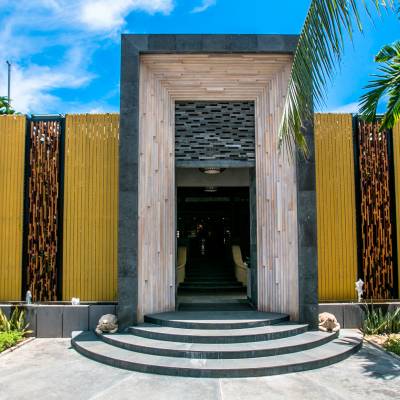 a palm tree in front of a building