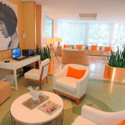 an orange room with a couch and a table