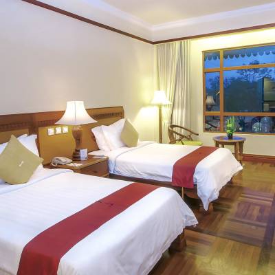 a bedroom with a large bed in a hotel room