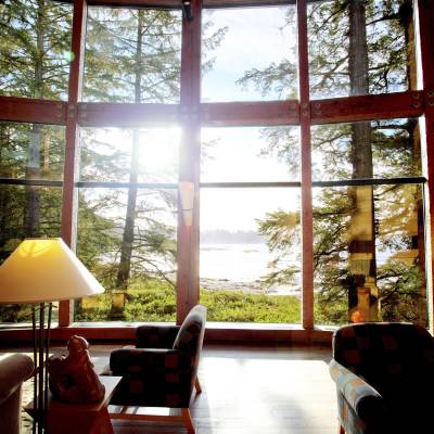 a living room filled with furniture and a large window