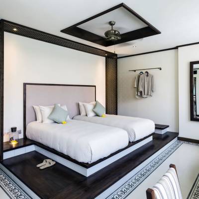 a bedroom with a bed and a mirror