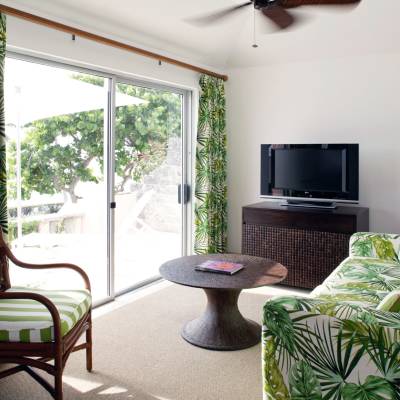 a living room filled with furniture and a large window