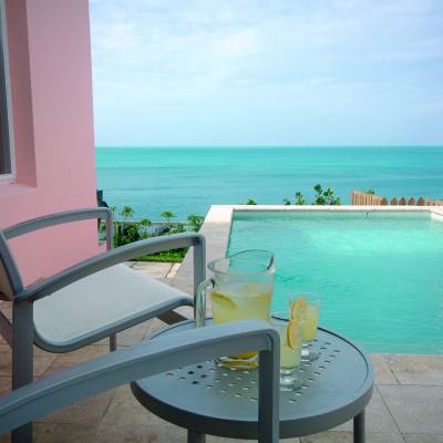 a chair sitting in front of a pool of water