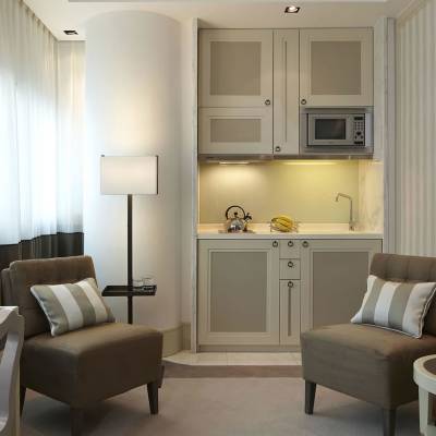 a living room filled with furniture and a curtain