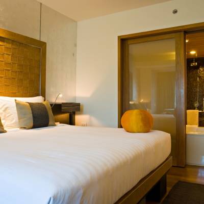 a bedroom with a bed in a hotel room