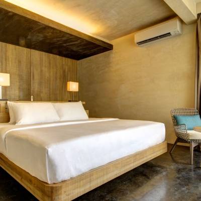a bedroom with a wooden floor