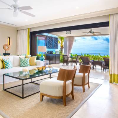 a living room filled with furniture and a large window