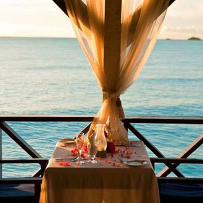 a chair sitting in front of a body of water