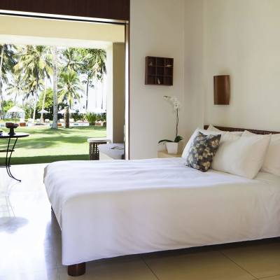 a large white bed in a room