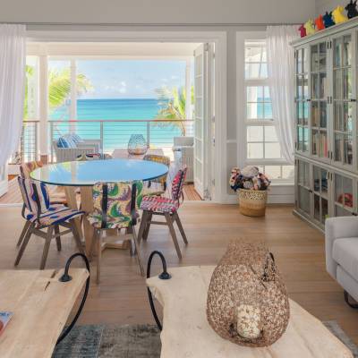 a living room filled with furniture and a large window