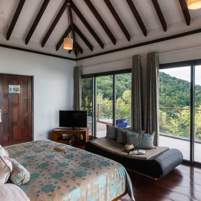 a living room with a bed and a window