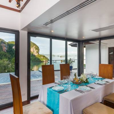 a dining room table in front of a window