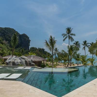 a pool of water surrounded by palm trees