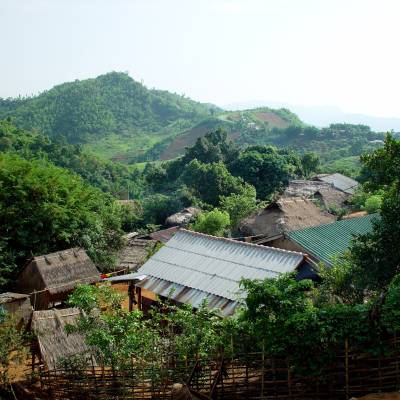 a building with a mountain in the background