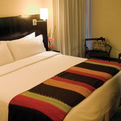 a bedroom with a bed in a hotel room