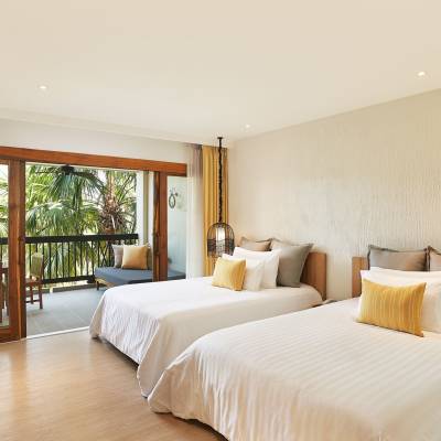 a bedroom with a large bed in a hotel room