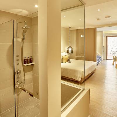 a room with a sink and a mirror