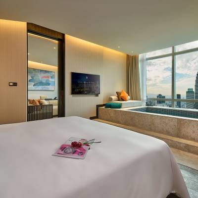 a hotel room with a bed and a large window