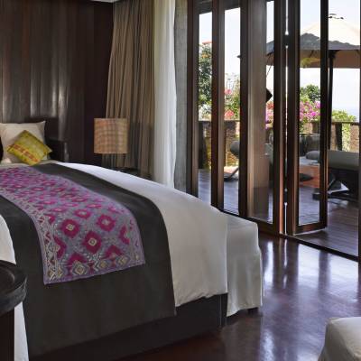 a hotel room filled with furniture and a large window