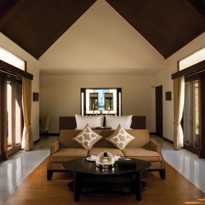 a view of a living room filled with furniture and a large window