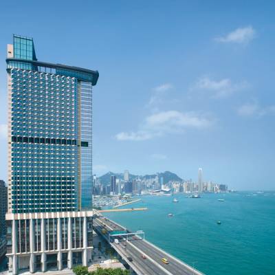 a large body of water with a city in the background