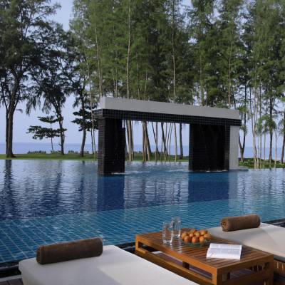 a pool next to a body of water