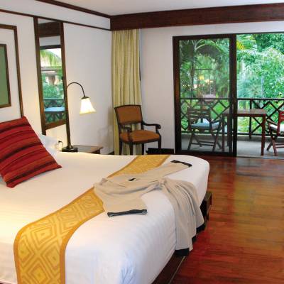 a bedroom with a large bed in a hotel room