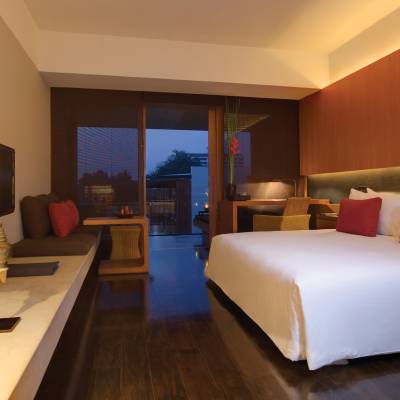 a bedroom with a large bed in a hotel room