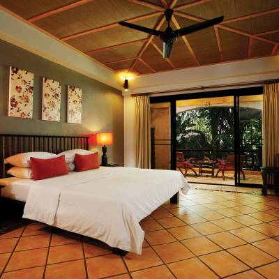 a bedroom with a large bed in a room