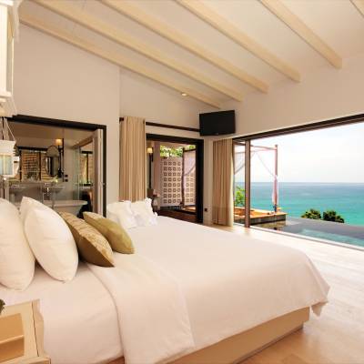 a large white bed in a room