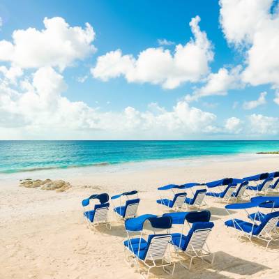 a sandy beach next to the ocean