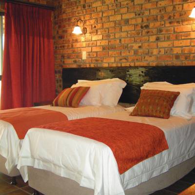 a bedroom with a large bed in a hotel room