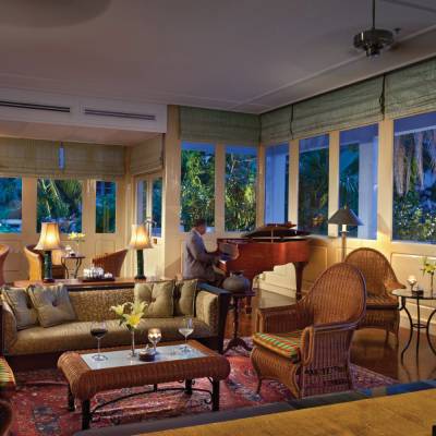 a living room filled with furniture and a large window
