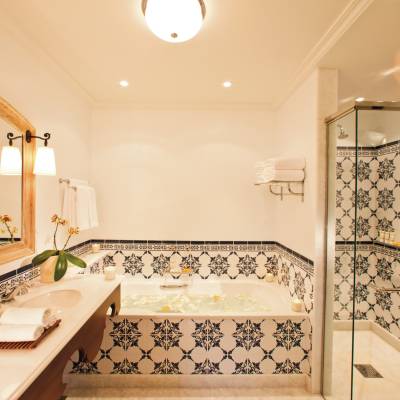 a room with a sink and a mirror