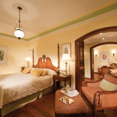 a bedroom with a large bed in a hotel room