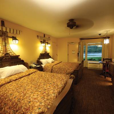 a bedroom with a large bed in a hotel room