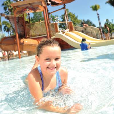 a young girl in a pool of water