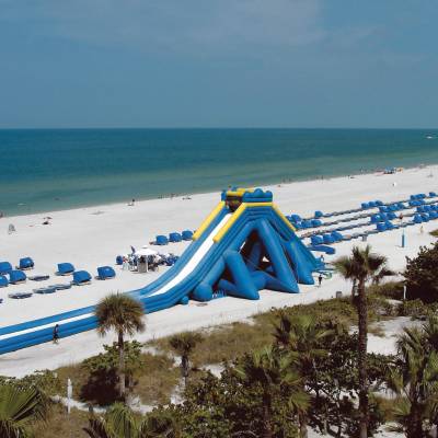 a sandy beach next to the ocean