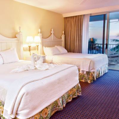 a bedroom with a large bed in a hotel room