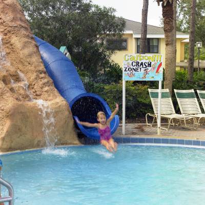 a child swimming in a pool of water