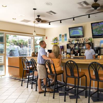 a kitchen with a table in a restaurant
