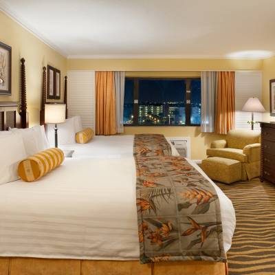 a bedroom with a large bed in a hotel room