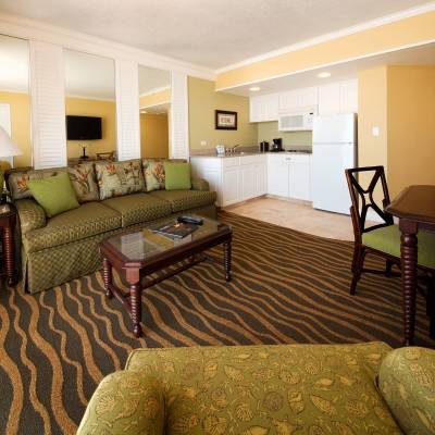 a living room filled with furniture and a large window